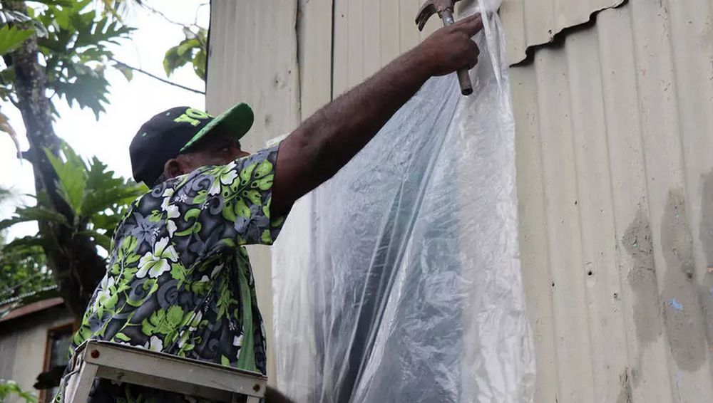 A resident of Fijiu00e2u20acu2122s capital Suva prepares his home for the arrival of super Cyclone Yasa. u00e2u20acu201d AFP pic