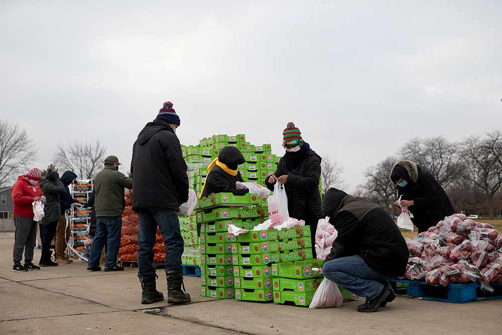 Volunteers from Forgotten Harvest food bank sort and separate different for distribution amid the  Covid-19 pandemic in Warren, Michigan December 21, 2020. u00e2u20acu201d Reuters picn
