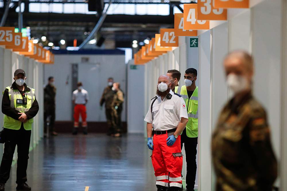 Staff wait for start of vaccination against Covid-19 at the Treptow Arena vaccination centre in Berlin, Germany December 27, 2020. u00e2u20acu201d Pool pic Reuters 