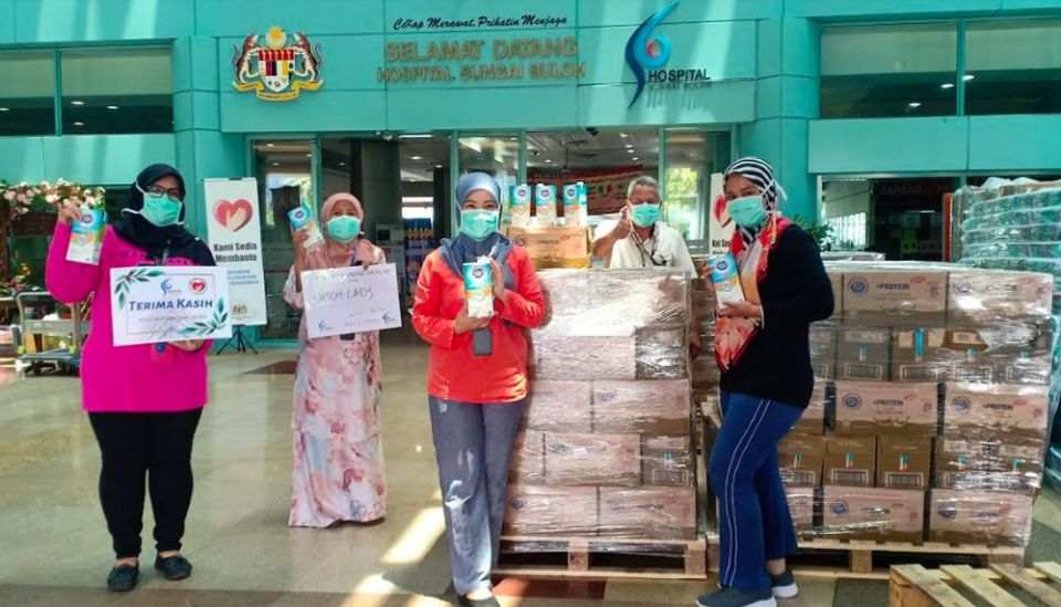 Dutch Lady Milk Industries Berhad delivers packs of Dutch Lady milk to medical frontliners at Sungai Buloh Hospital. — Picture courtesy of Dutch Lady Milk Industries Berhad
