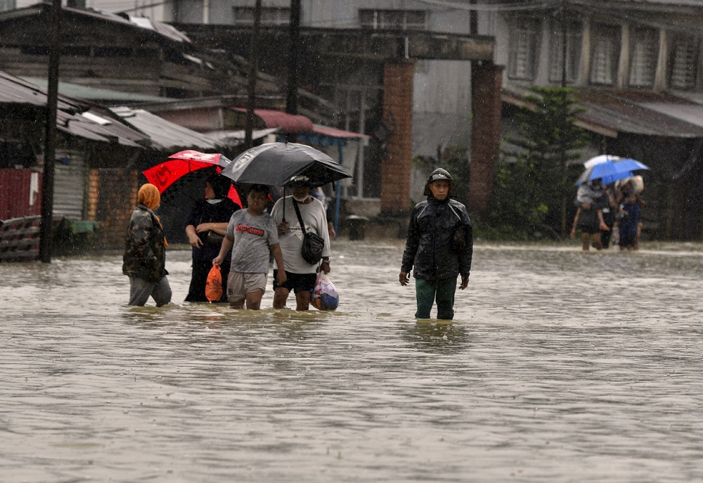 Residents wade through flood waters in Pasir Mas, Kelantan December 20, 2020. u00e2u20acu2022 Bernama pic