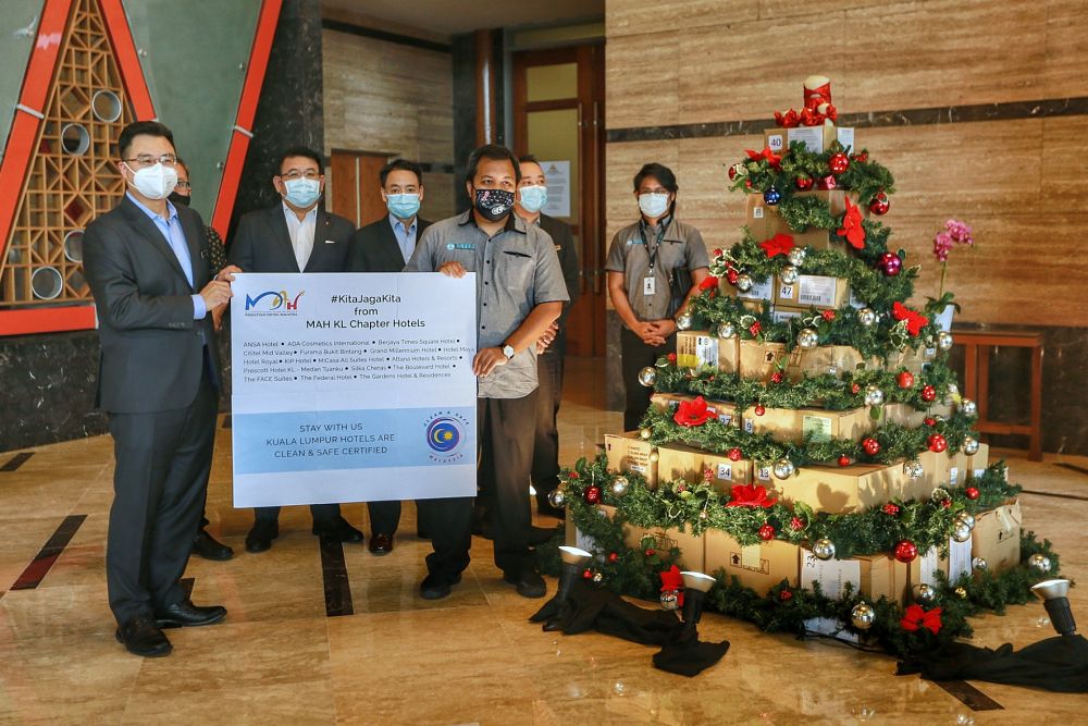 Malaysian Association of Hotels KL chapter chairman BE Lim (left) during the handover ceremony at St Giles The Gardens Hotel in Kuala Lumpur December 22, 2020. u00e2u20acu2022 Picture by Ahmad Zamzahurinn