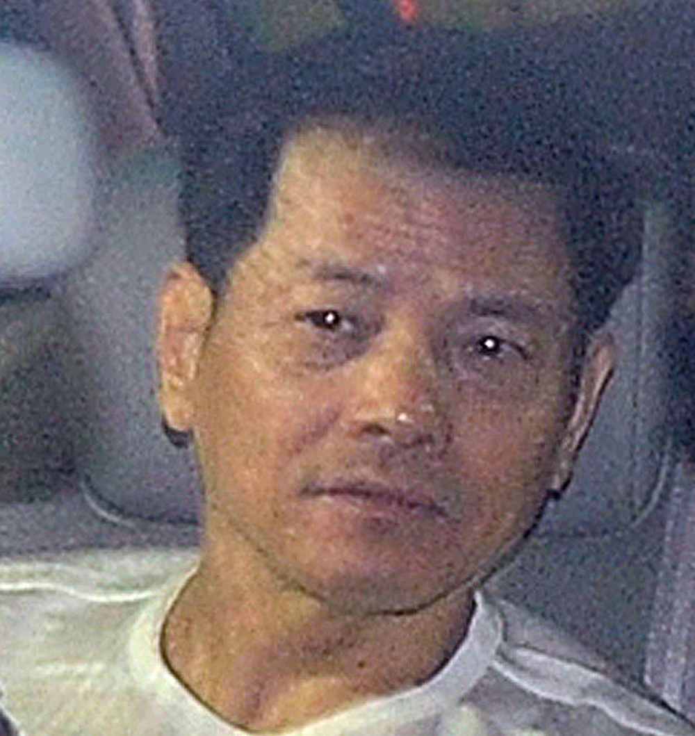 Wan Kuok-koi is driven away from the Macau prison December 1, 2012. u00e2u20acu201d AFP pic
