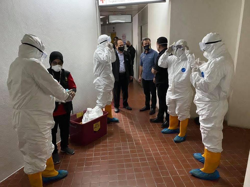 Penang Island City Council personnel conduct sanitisation at the Treasury Department after detection of a Covid-positive case at Komtar December 10, 2020. u00e2u20acu2022 Picture courtesy of MBPP