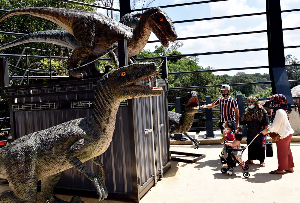 Melaka Zoo visitor, Muhammad Akhmar Rahim, 30, (left) and his family at the zoo during a Bernama survey after a press conference on standard operating procedures (SOP) at the Melaka Zoo December 30, 2020. u00e2u20acu201d Bernama pic 
