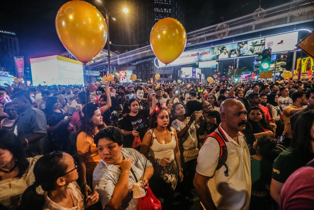 People celebrate during the New Year countdown at Bukit Bintang in Kuala Lumpur January 1, 2020. u00e2u20acu201d Picture by Firdaus Latif