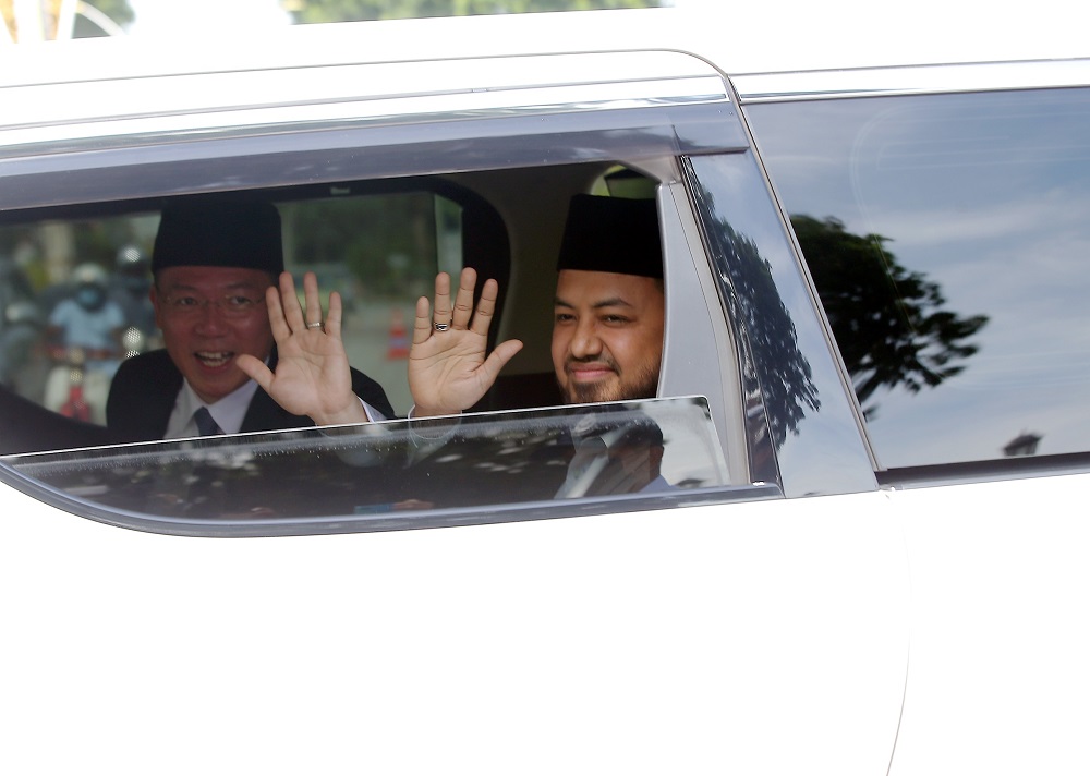Perak PKR chief Farhash Wafa Salvador Rizal Mubarak and Perak DAP chairman Nga Kor Ming are seen leaving Istana Kinta in Ipoh December 5, 2020. u00e2u20acu2022 Picture by Farhan Najib