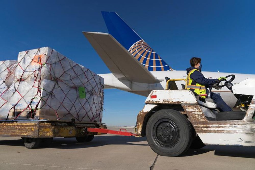 A shipment of Pfizeru00e2u20acu2122s coronavirus disease (Covid-19) vaccines is unloaded from a United Airlines cargo-only flight from Brussels to Ou00e2u20acu2122Hare International Airport in Chicago, US December 2, 2020. u00e2u20acu201d United Airlines/Handout via Reuters