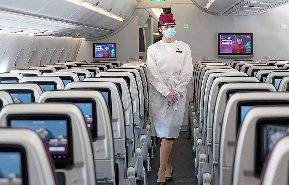 Disposable protective gowns, safety glasses, gloves and a mask are now part of the cabin crew’s uniform. — Picture courtesy of Qatar Airways