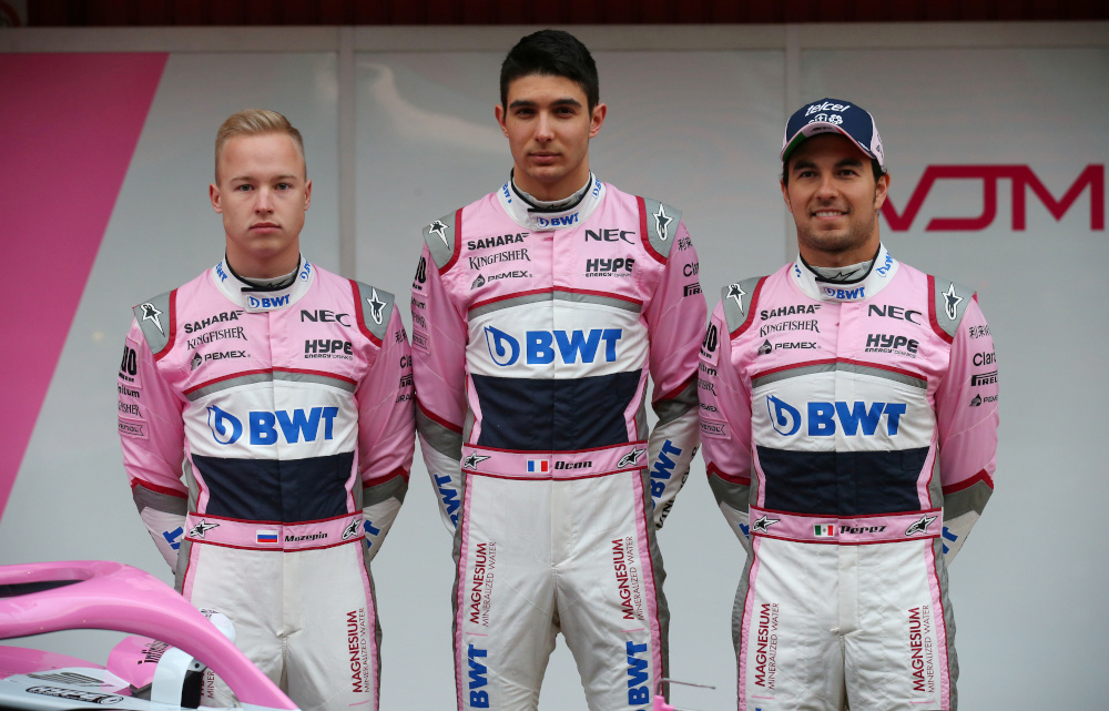 Nikita Mazepin (left) stands alongside Esteban Ocon (centre) and Sergio Perez (wearing cap) of Force India during the Formula One Test Session at Circuit de Catalunya, Montmelo February 26, 2018. u00e2u20acu201d Reuters pic