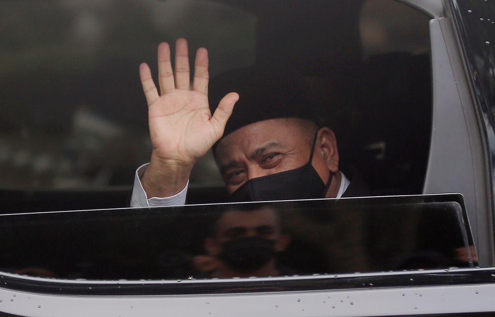 Perak Umno chief Datuk Saarani Mohamad waves as he leaves Istana Kinta, Ipoh December 9, 2020. u00e2u20acu201d Picture by Farhan Najib