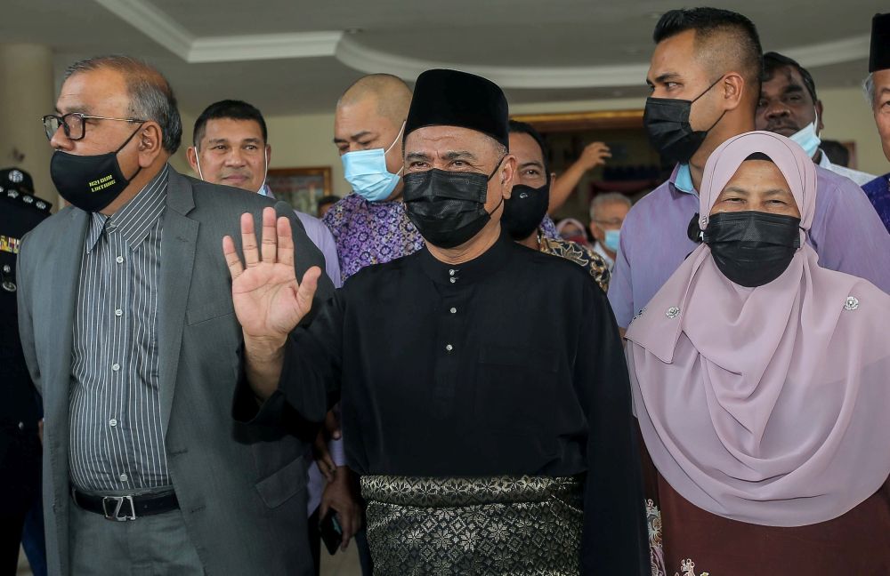 Datuk Saarani Mohamad waves at reporters after being sworn in as Perak mentri besar at Jubli Hall Kuala Kangsar December 10, 2020. u00e2u20acu201d Picture by Farhan Najib
