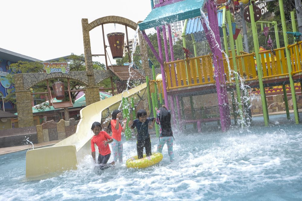 Children have fun at the Sunway Lagoon water park in Subang Jaya December 19, 2020. — Picture by Shafwan Zaidon