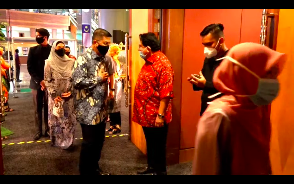 Datuk Seri Tengku Adnan Mansor greets Datuk Seri Azmin Ali at his sonu00e2u20acu2122s wedding reception December 20, 2020. u00e2u20acu201d Screenshot from https://hafizoceane.com/live/