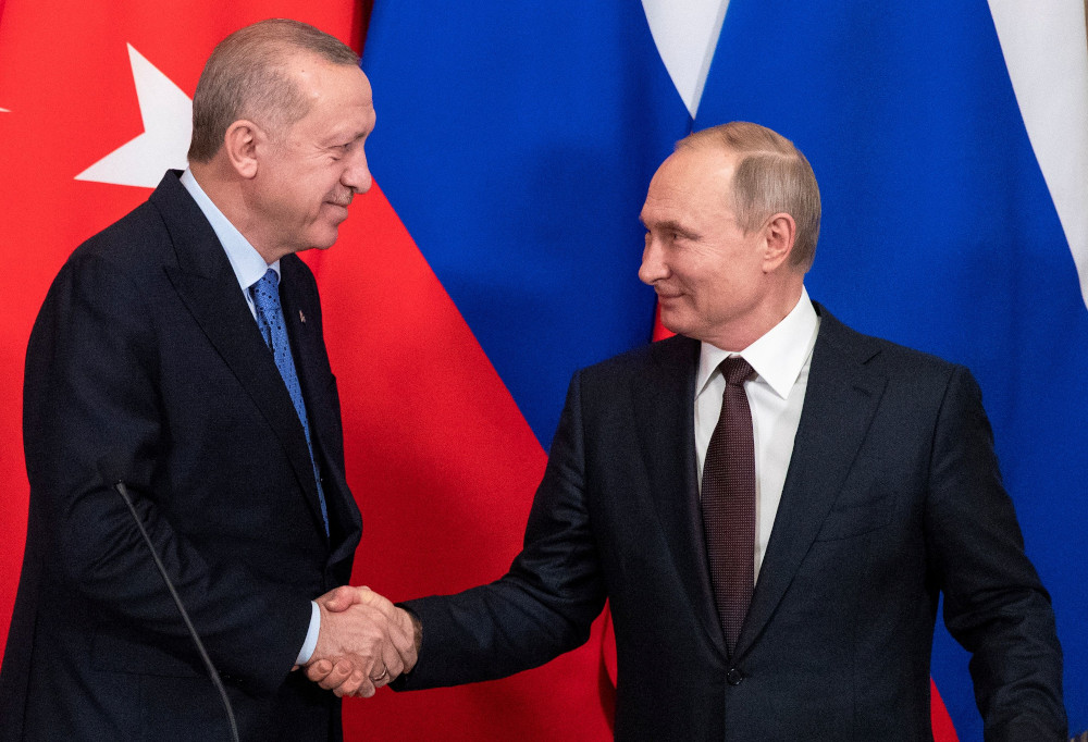 Russian President Vladimir Putin and Turkish President Tayyip Erdogan shake hands during a news conference following talks in Moscow, Russia March 5, 2020. u00e2u20acu201d Reuters pic 