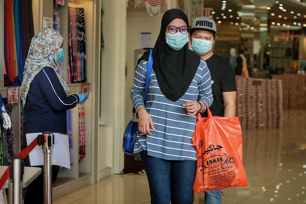 Customers shop for Hari Raya outfits at Jakel Mall in Kuala Lumpur May 4, 2020. u00e2u20acu201d Picture by Ahmad Zamzahuri