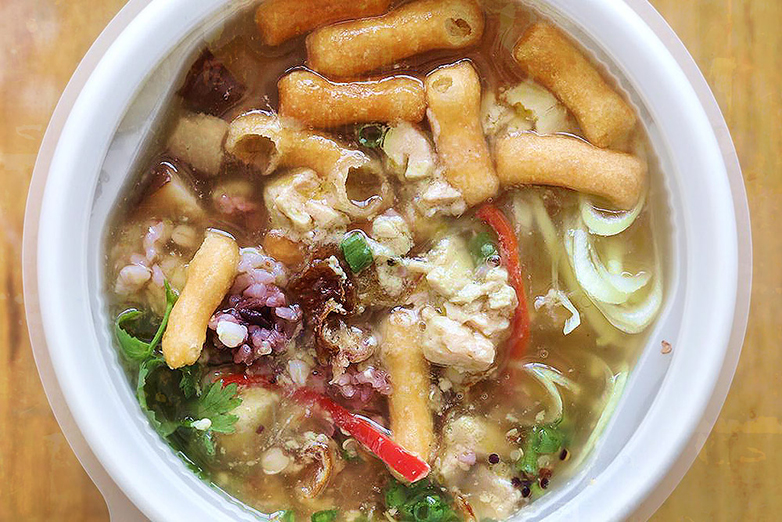 Chef Gaggan’s multigrain 'khao tom' (Thai rice congee) with smoked 'foie gras' and 'patongko' fritters.