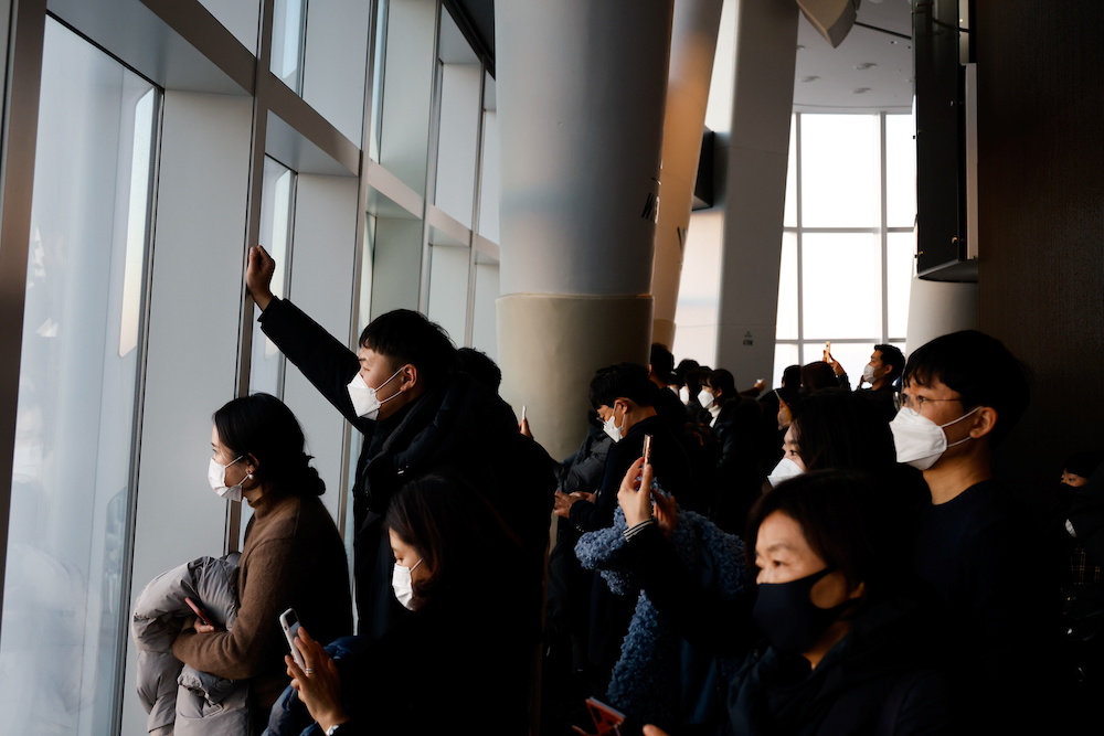 People view the sunset on New Year's Eve at the Seoul Sky Observatory, South Korea, December 31, 2020. u00e2u20acu201d Reuters pic