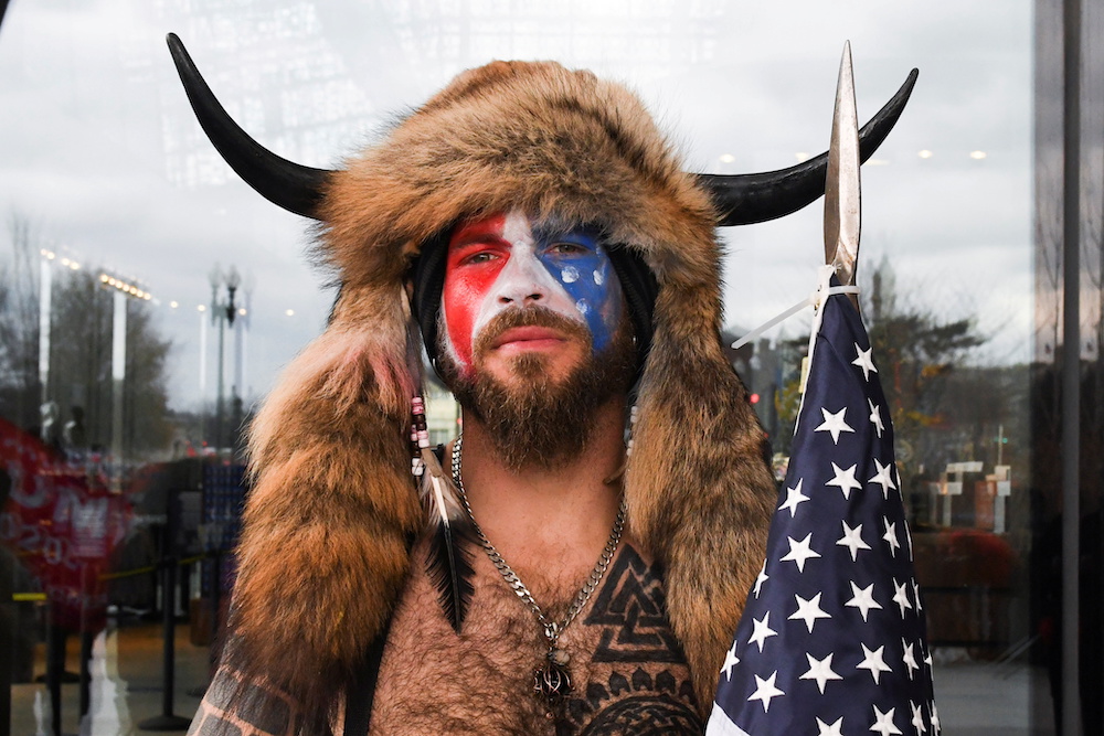 A man with his face painted in the colours of the US flag poses for a picture as supporters of US President Donald Trump gather in Washington January 6, 2021. u00e2u20acu201d Reuters pic 