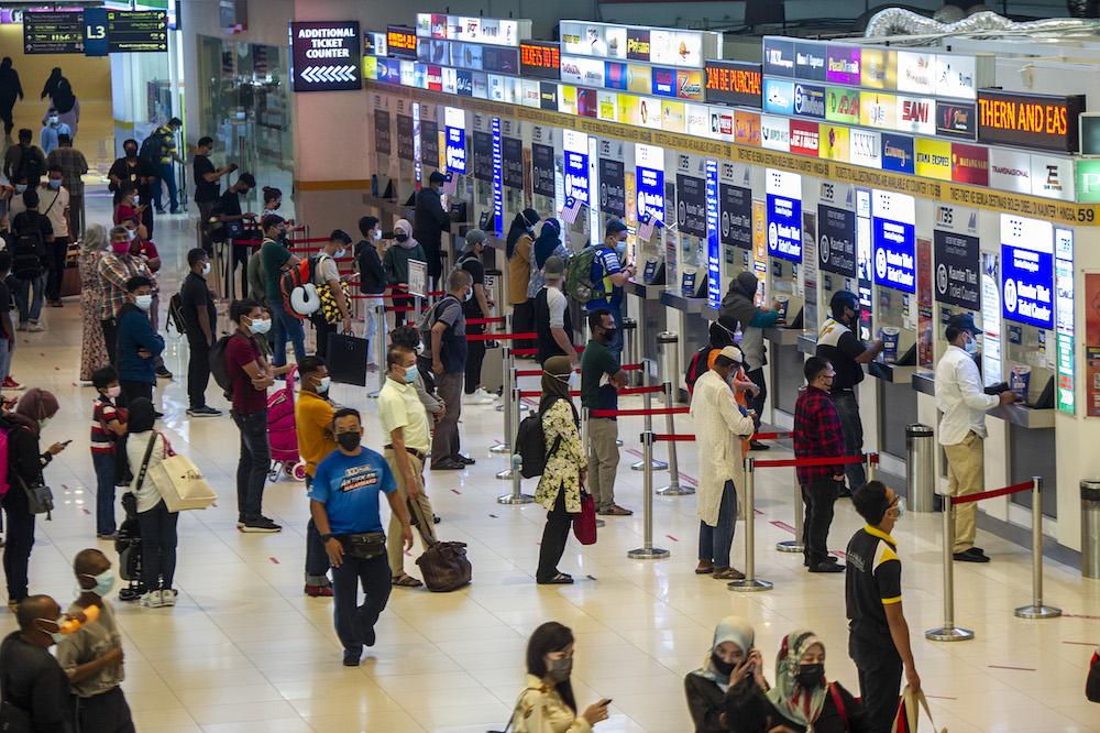 Members of the public are seen at Terminal Bersepadu Selatan in Kuala Lumpur after the government announced the reimplementation of the movement control order, January 12, 2021. u00e2u20acu201d Picture by Shafwan Zaidon