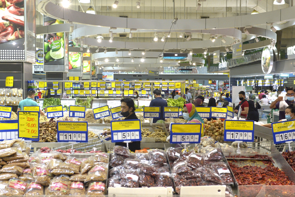 People shop for groceries at a supermarket in Subang Jaya a day before the movement control order (MCO) takes effect, January 12,2021. u00e2u20acu201d Picture by Miera Zulyana