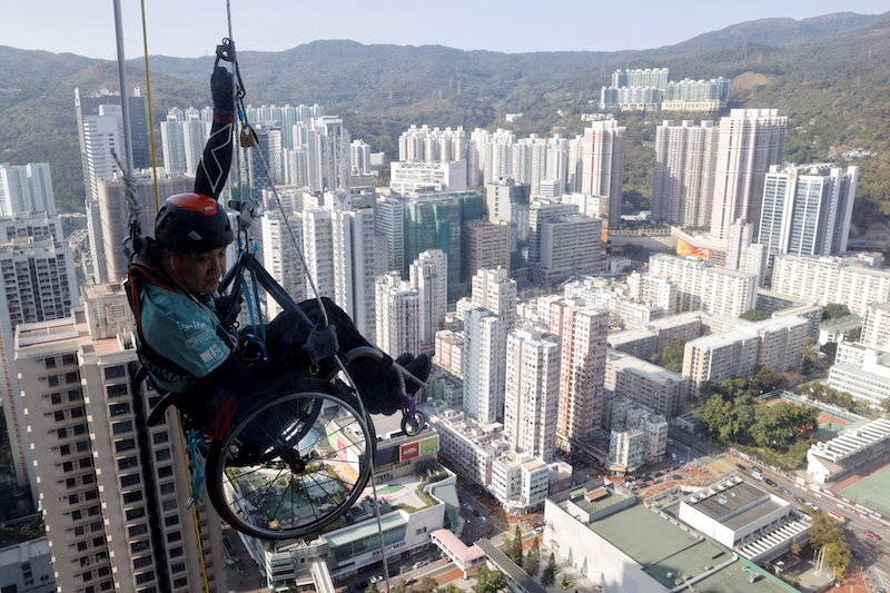 Lai Chi-wai, a paraplegic climber, attempts to climb the 320-metre tall Nina Tower using only his upper body strength, in Hong Kong, China January 16, 2021. u00e2u20acu201d Reuters pic