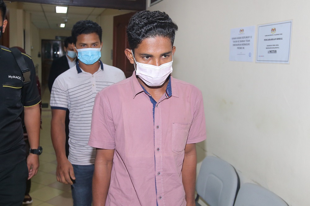 Myanmar refugees Abdul Manaf Abu Khalaf, 28, and Arif Dilda Amin, 24, at the Session Court in Ipoh January 6, 2021. u00e2u20acu201d Picture by Farhan Najib