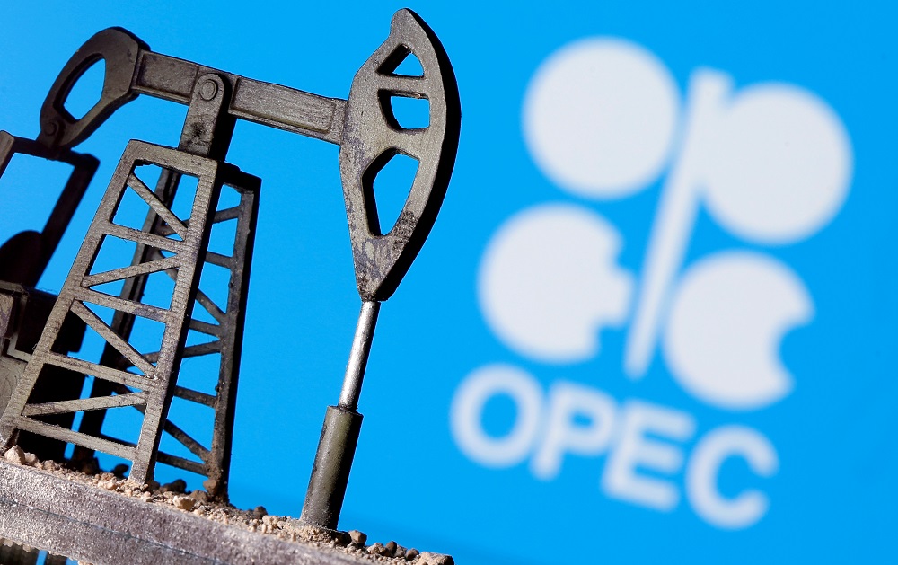 A 3D printed oil pump jack is seen in front of displayed Opec logo in this illustration picture, April 14, 2020. u00e2u20acu201d Reuters pic