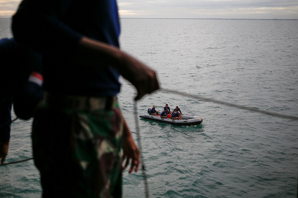 Indonesian navy divers are seen on a rubber boat while preparing to take part in the search and rescue operation for the Sriwijaya Air flight SJ 182, at the sea off the Jakarta coast January 12, 2021. u00e2u20acu201d Reuters pic