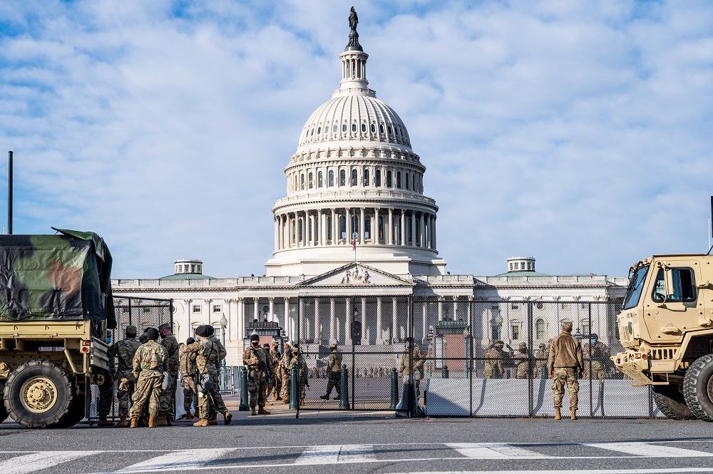 National Guard troops standing guard by non-scalable fencing that was recently installed around the Capitol in Washington January 13, 2021. u00e2u20acu201d Picture by Michael Brochstein/Sipa USA via Reuters