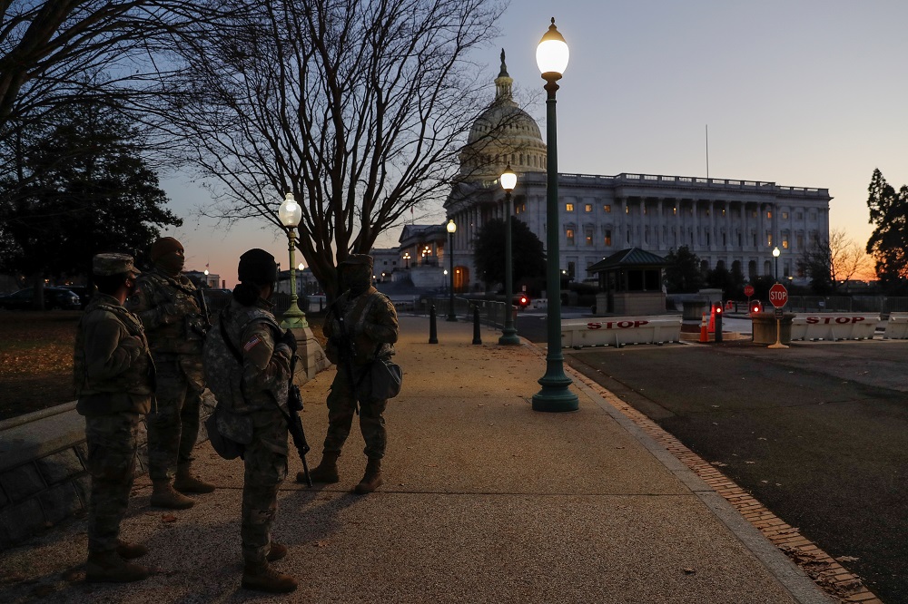 US National Guard members stand near the US Capitol Building on Capitol Hill in Washington January 13, 2021. — Reuters pic