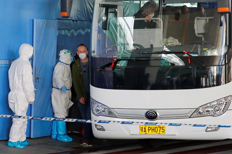 Members of the WHO team tasked with investigating the origins of the coronavirus disease pandemic board a bus before leaving Wuhan Tianhe International Airport in Wuhan, Hubei province January 14, 2021. u00e2u20acu201d Reuters pic