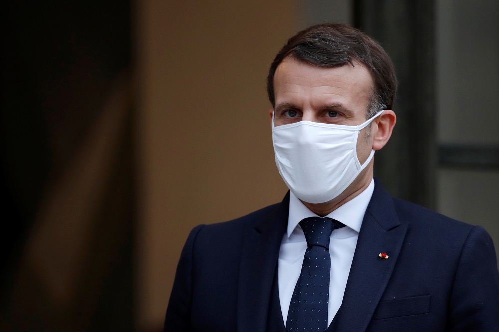 French President Emmanuel Macron, wearing a protective face mask, accompanies Interim Malian President Bah Ndaw (not seen) after a meeting at the Elysee Palace in Paris January 27, 2021. u00e2u20acu201d Reuters pic