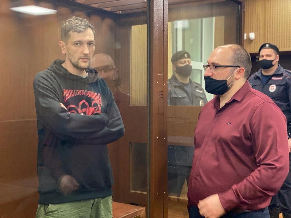 Oleg Navalny, brother of Russian opposition leader Alexei Navalny, who was detained for allegedly breaching COVID-19 safety restrictions, stands inside a defendant dock as he attends a court hearing in Moscow January 29, 2021. u00e2u20acu201d Press service of Tversko