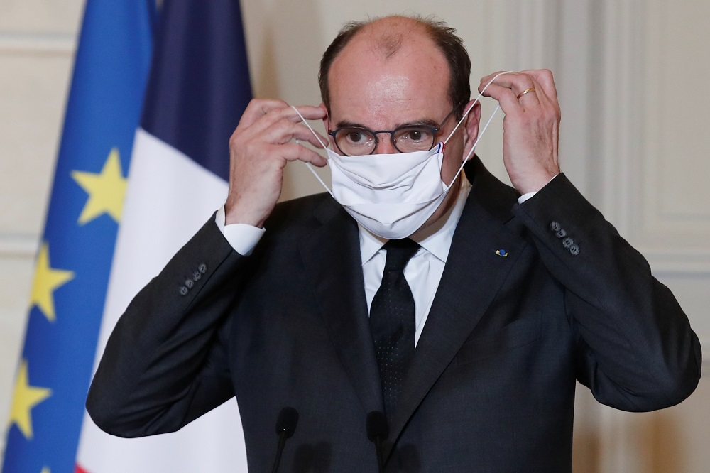 French Prime Minister Jean Castex puts on his protective face mask after delivering a speech following a meeting, amid the outbreak of the coronavirus disease, at the Elysee Palace in Paris January 29, 2021. u00e2u20acu201d Reuters pic