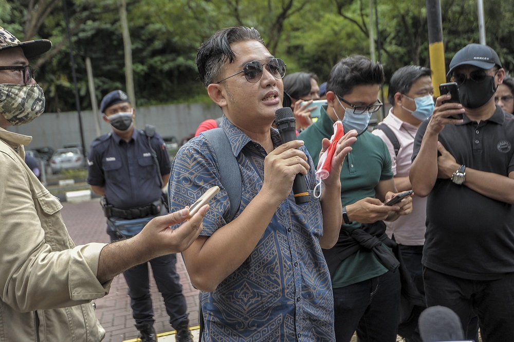 Tajuddin Abdul Rahmanu00e2u20acu2122s son, Faizal Tajuddin, answering questions raised by MUDA members during a press conference at the Dang Wangi LRT station in Kuala Lumpur January 5, 2020. u00e2u20acu201d Picture by Shafwan Zaidon