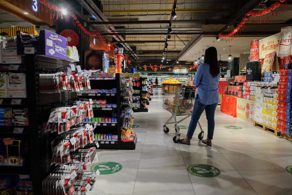 A man wearing a face mask shops for groceries at the Village Grocer at Mid Valley in Kuala Lumpur January 9, 2021. u00e2u20acu201d Picture by Yusof Mat Isa