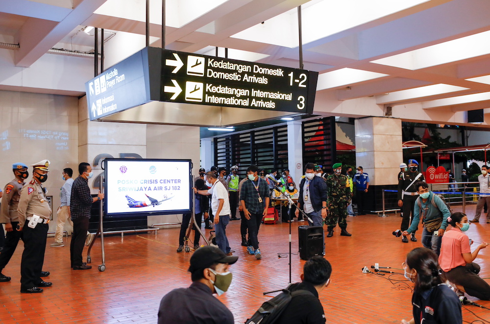 Members of the media gather in the domestic terminal of Soekarno-Hatta International Airport, after Sriwijaya Air plane flight SJ182 lost contact after taking off, in Tangerang, near Jakarta, Indonesia, January 9, 2021. u00e2u20acu201d Reuters pic