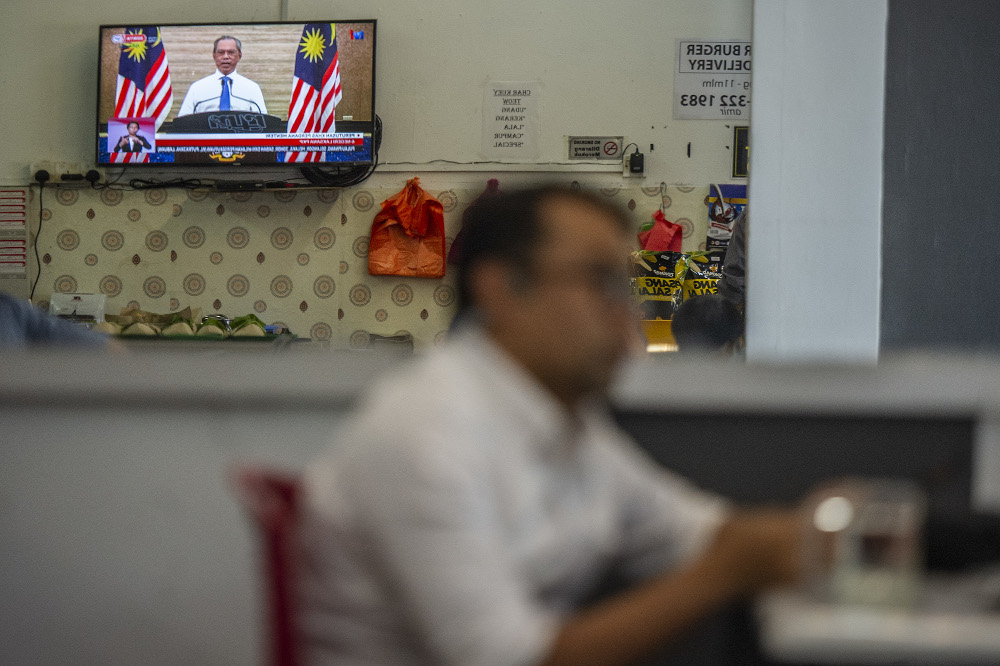 The live telecast of Prime Minister Tan Sri Muhyiddin Yassin is seen in a restaurant in Kajang January 11, 2020. — Picture by Shafwan Zaidon