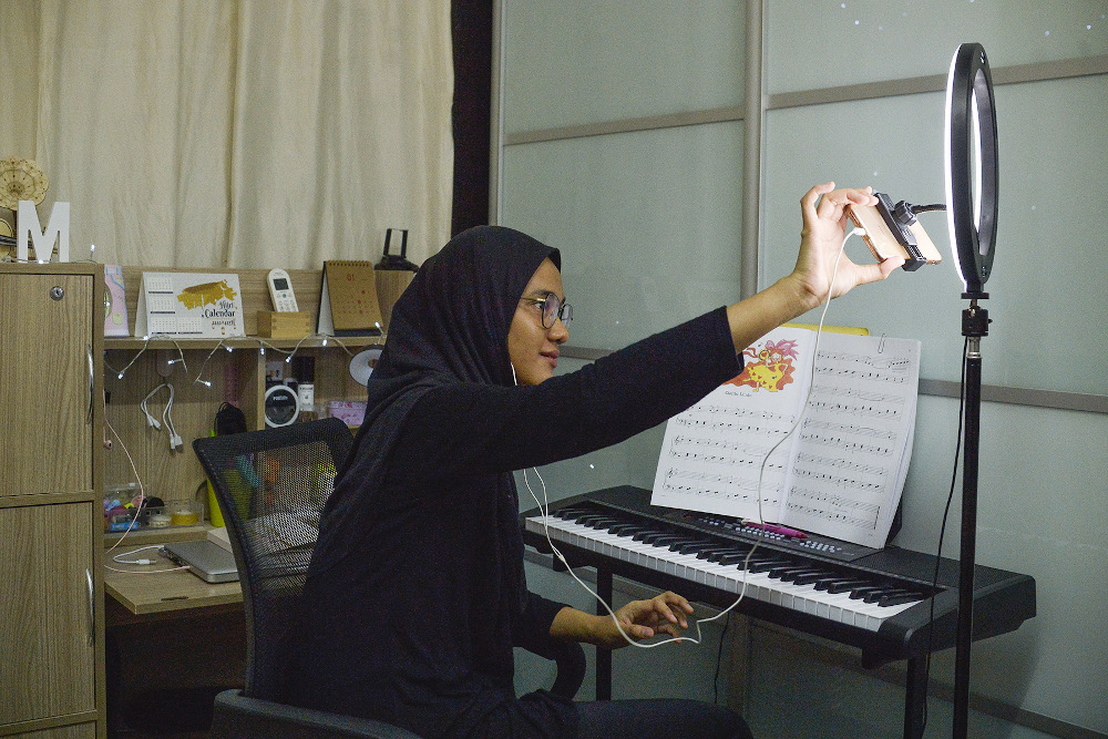 A music teacher teaches an online piano class during the movement control order (MCO) in Shah Alam January 24, 2021. — Picture by Miera Zulyana  