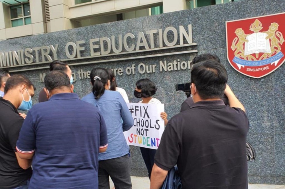 Three people who gathered outside the Ministry of Educationu00e2u20acu2122s headquarters ignored warnings from the police warnings to stop their activities for which they did not get a permit. u00e2u20acu201d TODAY pic