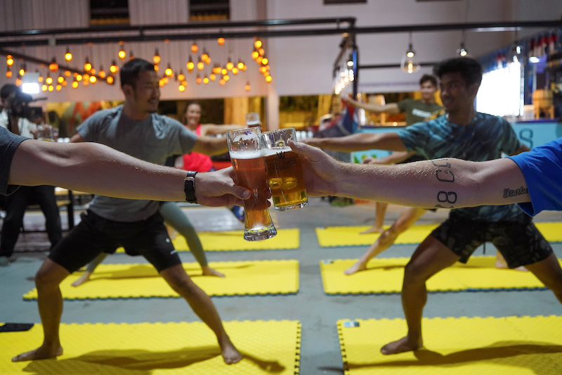 People participate in a beer yoga session, as the country eases Covid-19 restrictions, at a craft brewery in Phnom Penh, Cambodia January 19, 2021. u00e2u20acu201d Reuters pic