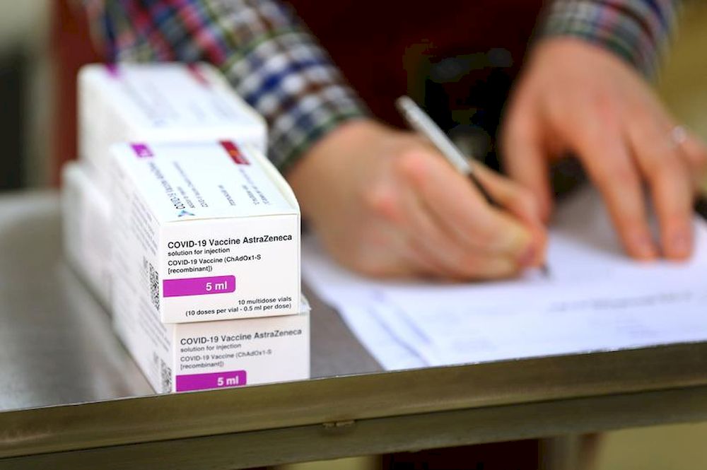 Doses of the Oxford University/AstraZeneca Covid-19 vaccine are logged by a technical officer, after they arrive at the Princess Royal Hospital in Haywards Heath, West Sussex, Britain, January 2, 2021. u00e2u20acu201d Pool picture via Reuters