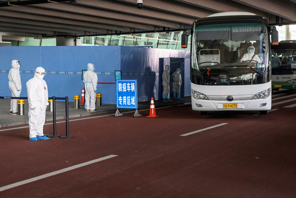 A bus carrying members of the WHO team tasked with investigating the origins of the coronavirus disease pandemic leaves Wuhan Tianhe International Airport in Wuhan, Hubei province, China January 14, 2021. u00e2u20acu201d Reuters picn