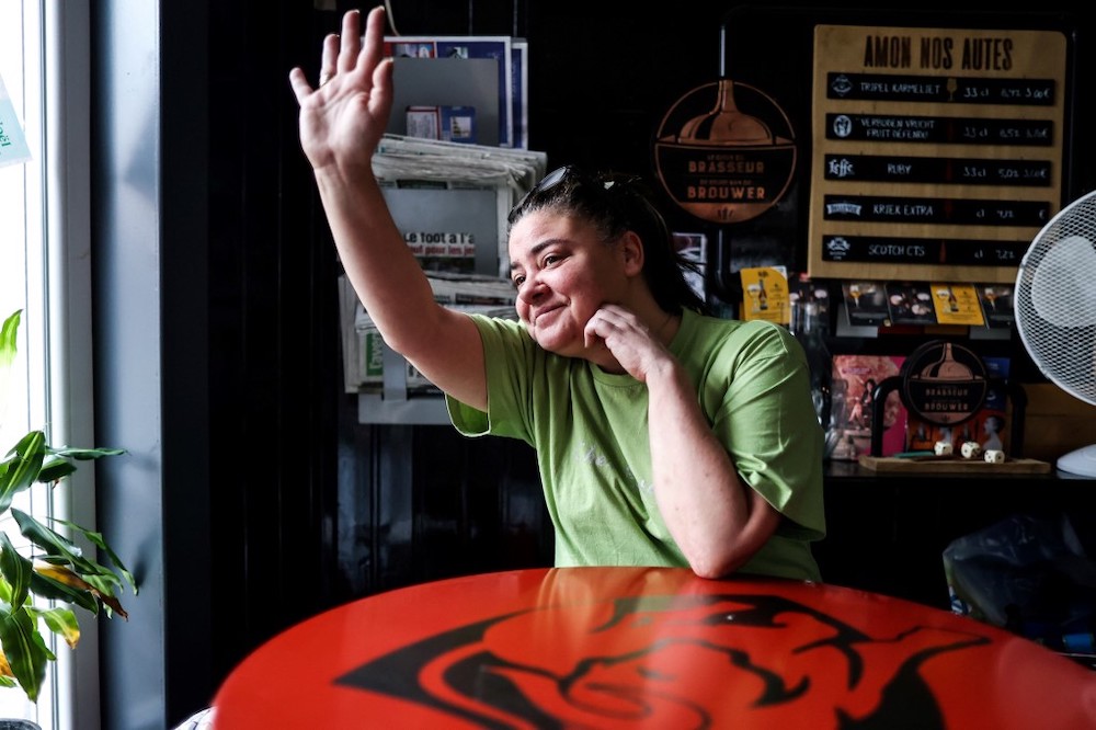 Christelle Carion, 48 years old, manager of the cafe ‘Amon nos autes’ in Pepinster poses in her cafe, on January 15, 2021, where she has been sleeping to protest against the closure of the bars and restaurants in Belgium as part of the measures adopte