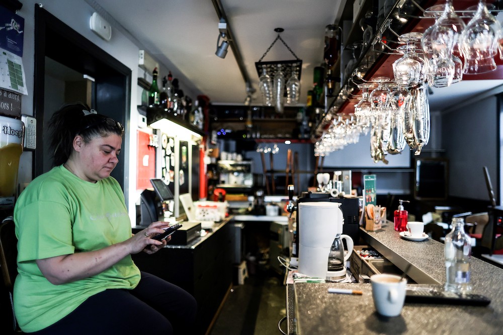 Christelle Carion, 48 years old, manager of the cafe ‘Amon nos autes’ in Pepinster poses in her cafe, on January 15, 2021, where she has been sleeping to protest against the closure of the bars and restaurants in Belgium as part of the measures adopte