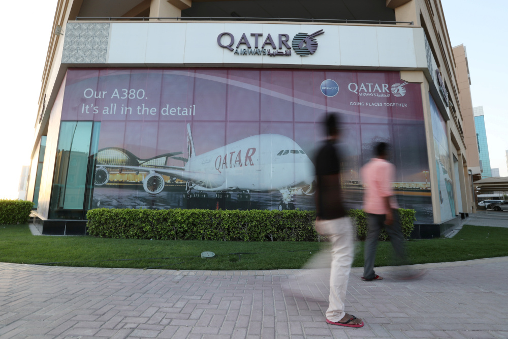 People walk past the Qatar Airways office in Manama, Bahrain, June 8, 2017. u00e2u20acu201d Reuters picnn