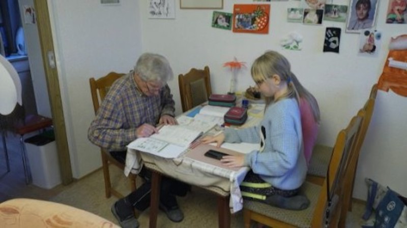 Old school: German great-granddad pitches in with homeschooling. u00e2u20acu201d AFP-Relaxnews picnn