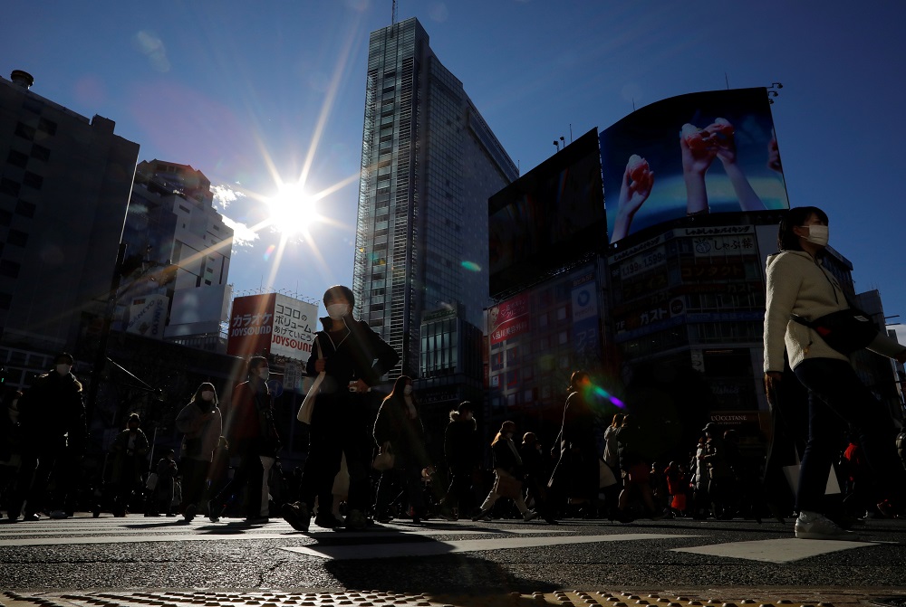 Passersby wearing protective face masks walks at Shibuya crossing after the government declared the second state of emergency for the capital and some prefectures, amid coronavirus disease outbreak, in Tokyo January 9, 2021. u00e2u20acu2022 Reuters pic