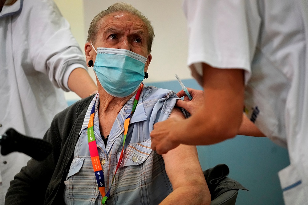 Amavir nursing home resident Hermelina Hernandez, 96, prepares to receive an injection with a dose of the Pfizer-BioNTech Covid-19 vaccine in Madrid December 30, 2020. u00e2u20acu2022 Reuters file pic